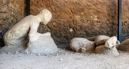 victims of the eruption of Vesuvius in Pompeii, plaster casts of the victims found in the buried...