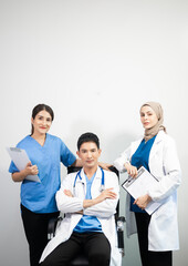 Successful team of medical doctors looking at camera and smiling while standin. Health, professional and people team.