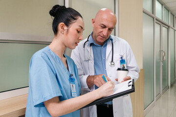 professor doctor give advice and discuss with intern student for surgery planning and patient...