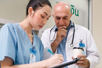 professor doctor give advice and discuss with intern student for surgery planning and patient...