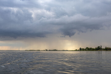 Clouds and rain over the river