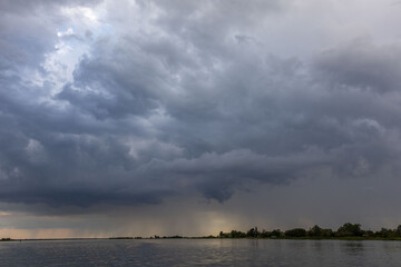 Clouds and rain over the river