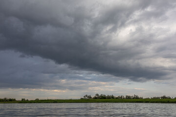 Clouds and rain over the river