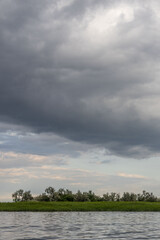 Clouds and rain over the river