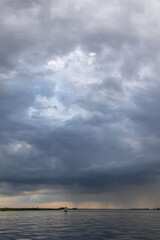 Clouds and rain over the river