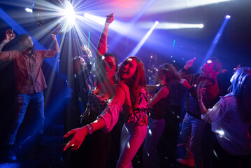 Drive And Energy In Nightclub, Young People Having Fun And Joy with dancing