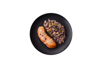 A piece of boiled salmon with rice, broccoli, salt and spices