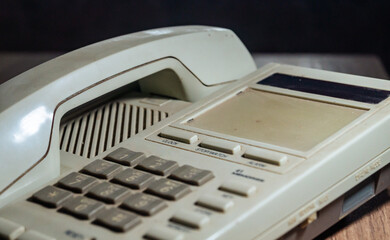 Old telephone with buttons on the panel. Old landline phone