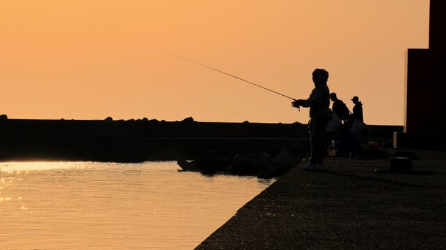 Fisherman showing an exceptional technique in a magnificent sunset