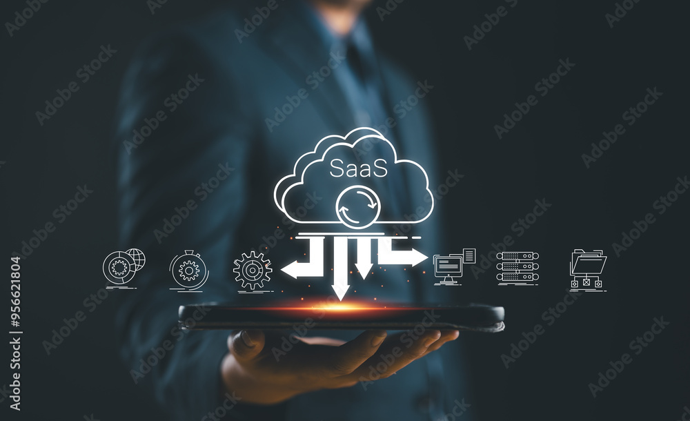 Poster SaaS (software as a service) concept, Businessman show virtual screen of SaaS icons for software services on cloud system. Internet and networking technology.