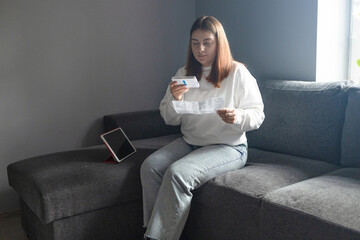 Caucasian woman using rapid antigen test kit for self test COVID-19 epidemic at home. Adult female unpacking a swab for inserts into her nose. COVID-19 coronavirus pandemic protection concept. 