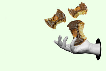 A hand holding three bitten donuts with chocolate frosting