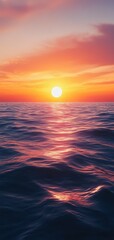 A serene sunset over a calm ocean, with vibrant colors reflecting on the water's surface, creating a tranquil atmosphere.