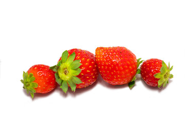 Ripe and delicious strawberries isolated on a white background