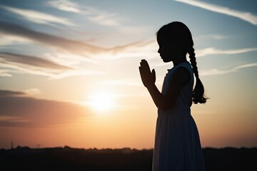 Praying Girl Silhouette at Sunrise Exploring Belief Unity and Inner Reflection