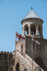 bell tower and Georgian flags