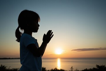 Child Praying at Dawn Capturing Themes of Faith Connection and Serene Harmony