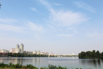 Fototapeta premium beautiful view of the city of Kyiv Ukraine on the Dnipro river, the sky, the river and the city of Kyiv