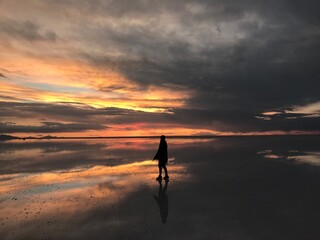 Uyuni Salt Flat sunset woman