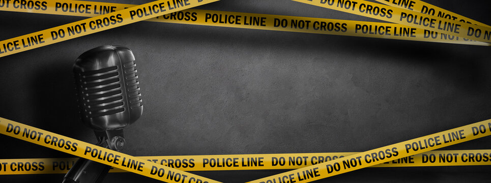 true crime podcast banner background. yellow police line - do not cross and vintage microphone on dark concrete background with copy space
