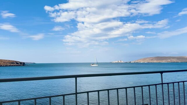 sailing boat anchored in the bay of sigri town of lesbos island greece clouds and islands