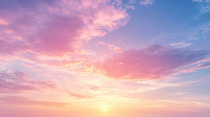 Obraz premium A beautiful sunrise showcasing a mesmerizing blend of pink and blue clouds against the dawning sky over the horizon.