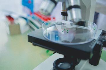 In this chemical experiment, two researchers collaborate to mix reactants, carefully observe changes such as color shifts or gas production, and analyze results, demonstrating principles of chemistry