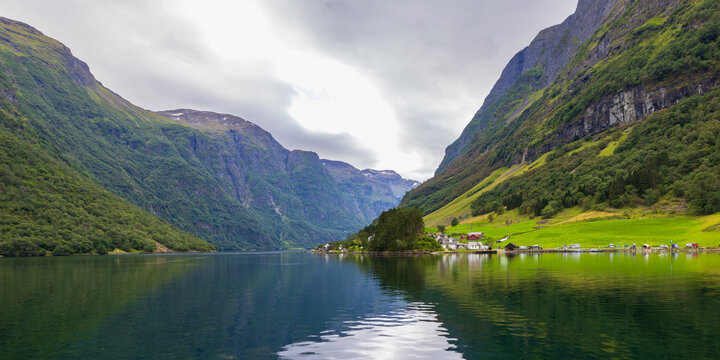 The village of Bakka along the N&aelig;r&oslash;yfjord, Norway, as seen from a Flam boat cruise