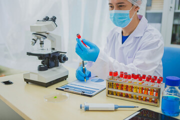 In this chemical experiment, two researchers collaborate to mix reactants, carefully observe...
