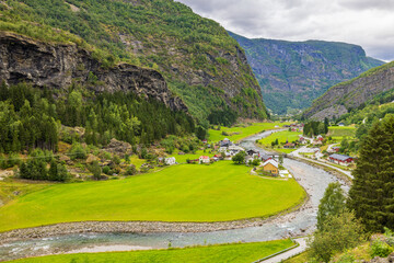 View of the southern part of the village of Flåm, valley and Flåmselvi river from the Flam railway (Flåmsbana), Norway