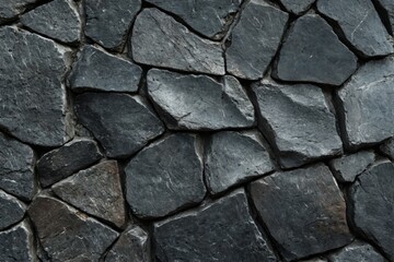 Fototapeta premium Close-up stone wall wall made up small irregularly Smooth Black