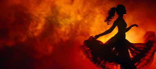 Obraz premium Silhouette of a Mexican woman dancing gracefully against a fiery orange backdrop