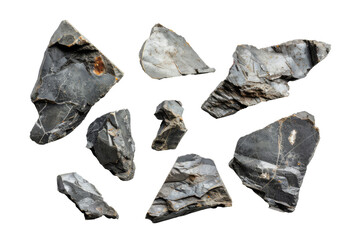 Collection of various black rock shards on transparent