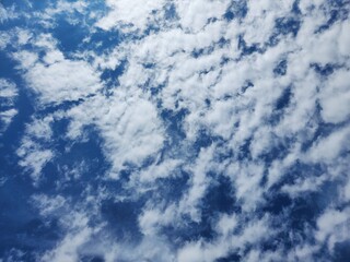 Obraz premium Clear blue sunny sky with clouds.