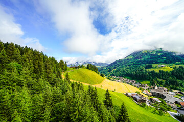 Obraz premium View of Auffach and the surrounding landscape. Idyllic town in the municipality of Wildschönau in the Kufstein district in Austria. Nature with mountains in Tyrol. 