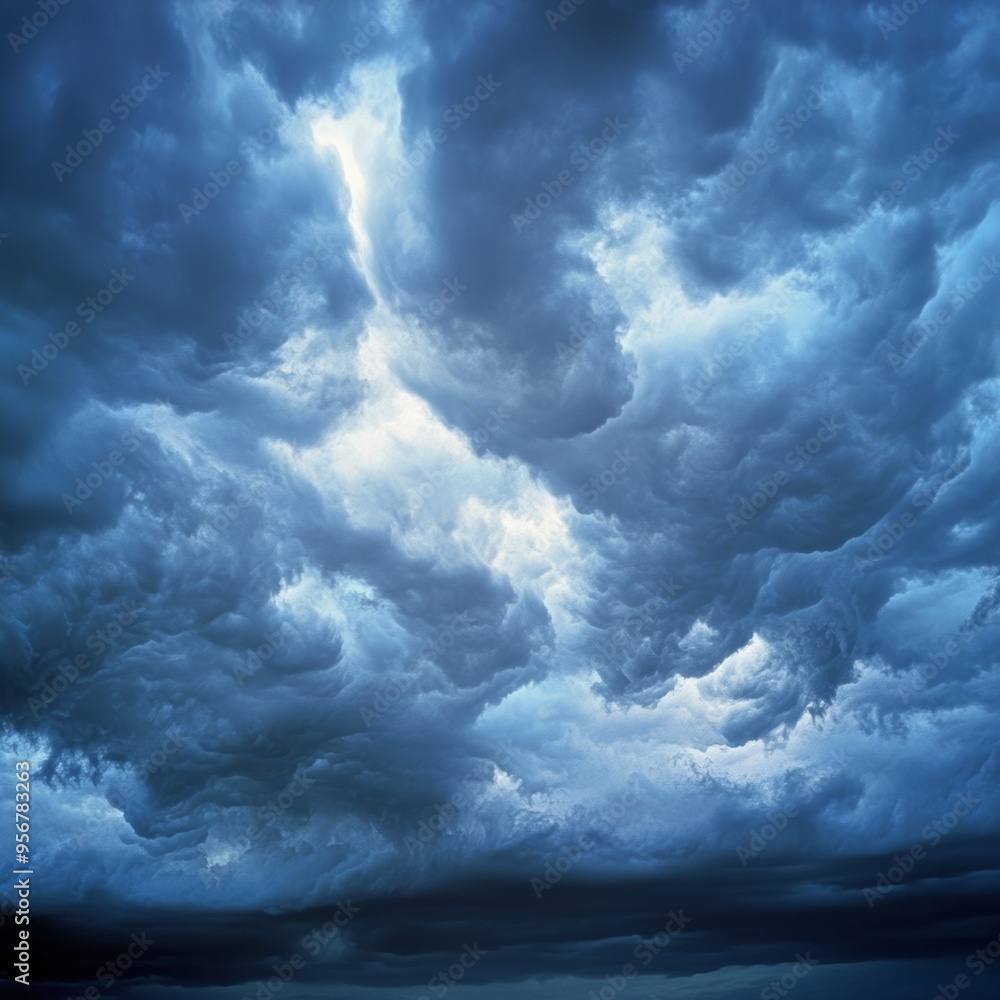 Poster Dramatic, dark, and ominous storm clouds fill the sky.