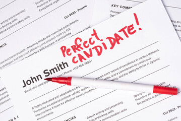 Fake mock CV (curriculum vitae) resume for John Smith, selected by HR as the perfect candidate for a job. Concept of job search, employee selection, recruitment process, work and hiring.
