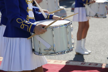 a drummer in a uniform with a drum