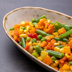 Mexican Mix of Vegetables. Tomatoes, Green Beans, Peas, Corn. Dietary Food.Bright vegetable mix .Vegetarian food.Assorted.