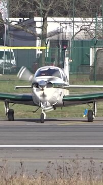 Private Small Airplane Aircraft Lining up on the runway at Local Regional Airport | small plane lining up rolling on the runway of a small regional airport