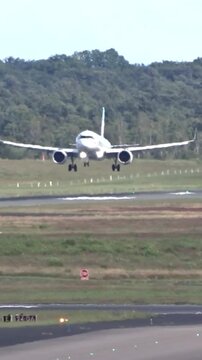 generic passenger jet landing airport focuses smooth touchdown aircraft&rsquo;s deceleration runway aviation airplane airport operations aviation video aircraft landing airport footage