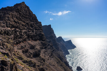 View of the Atlantic Ocean and the rocky steep coast from the observation deck - Mirador de Balcon. Gran Canaria. Canary Islands. Spain.