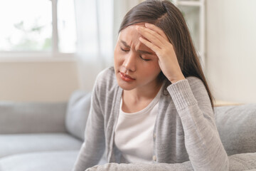 Young Asian females feeling dizzy after standing too fast, have symptoms of low blood pressure