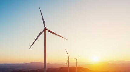 Obraz premium A Serene Sunset Over Wind Turbines Showcases Nature's Power and Beauty in Harmony with Renewable Energy and the Environment's Future.
