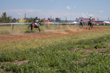 Horse racing at the racetrack. Horses led by riders gallop. Horse riders compete in speed. Horses...