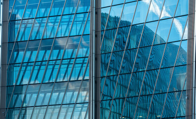 Obraz premium modern architectural background, glass and metal facade of contemporary building