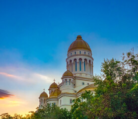 Sunset over the People's Salvation Cathedral (Catedrala Mântuirii Neamului), also known as the National Cathedral (Catedrala Națională), under construction in Bucharest, Romania