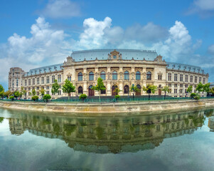 The Dâmbovița river flowing through Bucharest, flanked by the imposing architecture of the...