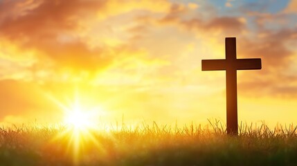 Silhouette christian cross on grass in sunrise background 
