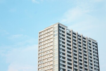 Modern High-Rise Apartment Building Against Clear Blue Sky, Hiroshima, Japan. With copy space